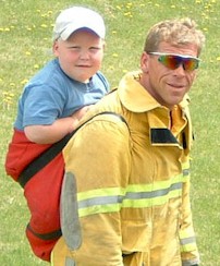 Ray and his son Jacob-- Ray jogs with Jacob in a backsack. 